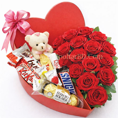 Heart shaped gift box with roses and chocolate